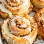 Warm Apple Pie Cinnamon Rolls in a skillet