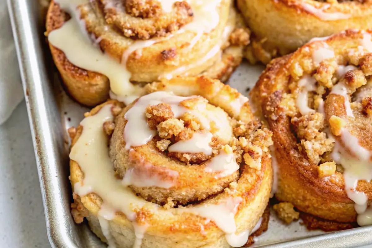 Warm Apple Pie Cinnamon Rolls in a skillet