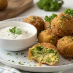 Golden, crispy broccoli cheese balls served with ranch dip and fresh parsley, a perfect snack or appetizer option.